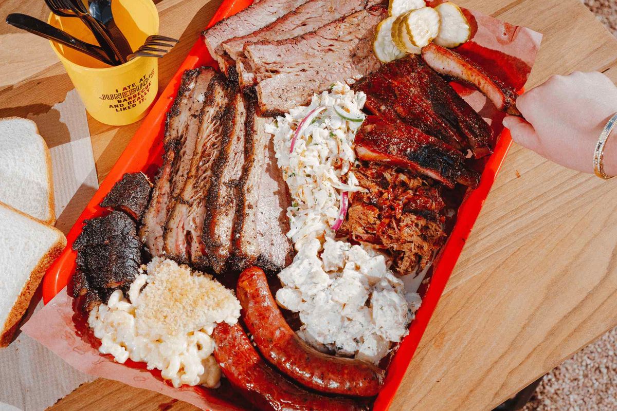 A loaded tray of Texas barbecue at Junebug's on The Wine & Smoke tour in Fredericksburg